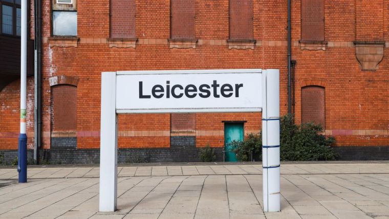 A railway sign saying "Leicester"